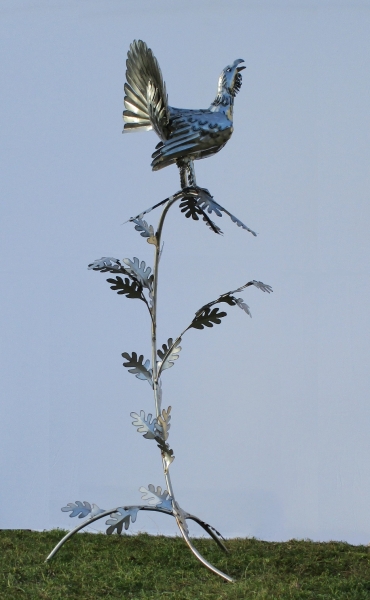 Capercaillie in tree sculpture